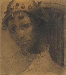 visage d'un homme coiffé d'un bonnet orné de clochettes