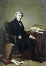 Portrait de Jules Michelet, homme assis à une table